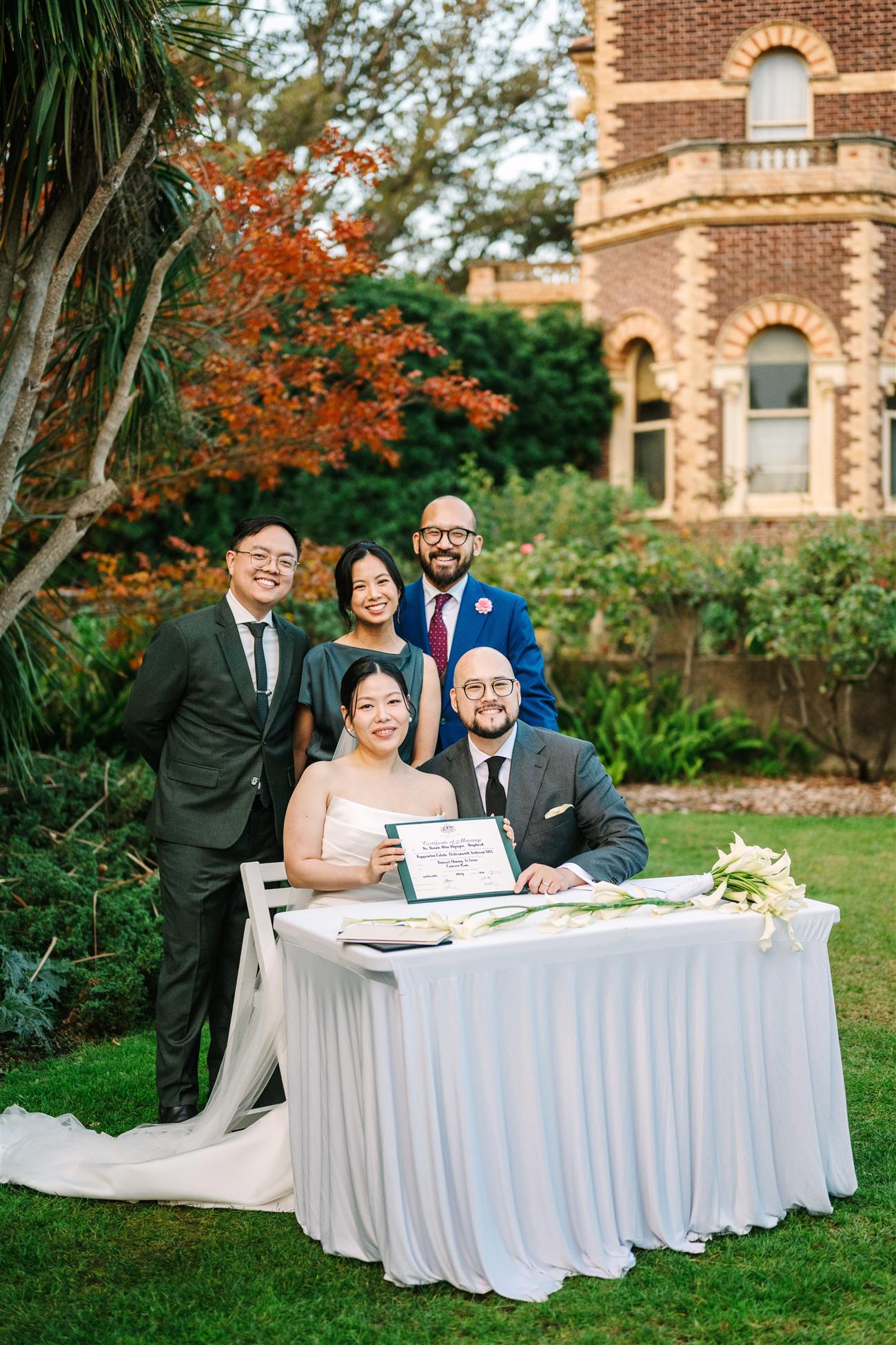 Vince celebrating with a newly married couple and their witnesses